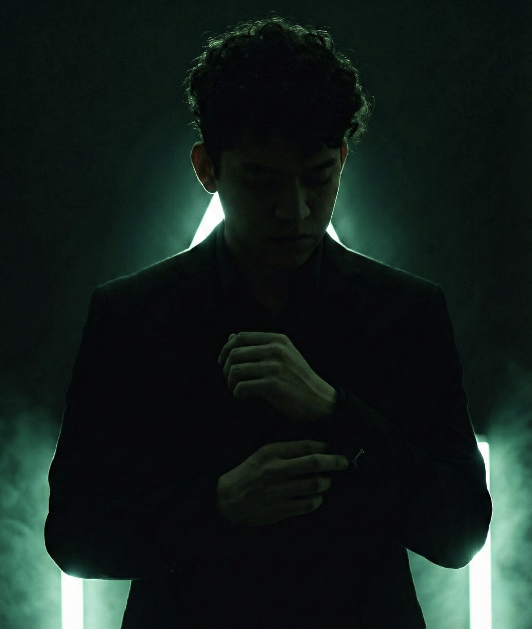 Moody portrait lit by green tube lights